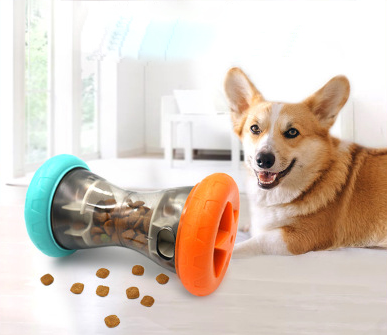 Picture of toy spilling treats with a dog.