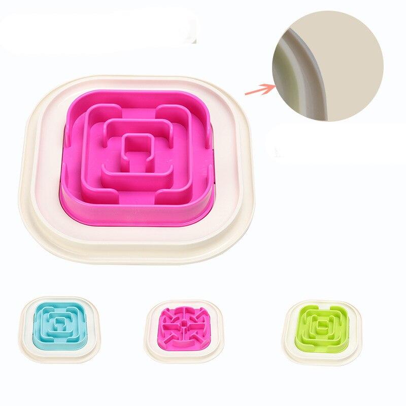 Image of pink slow feeding dish with the blue one and green one.